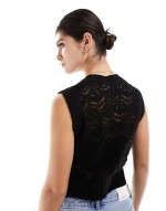 knitted tank in open stitch in black
